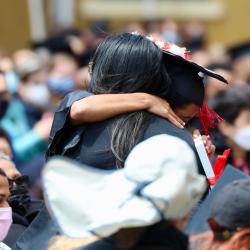 Student hugging a teacher at graduation