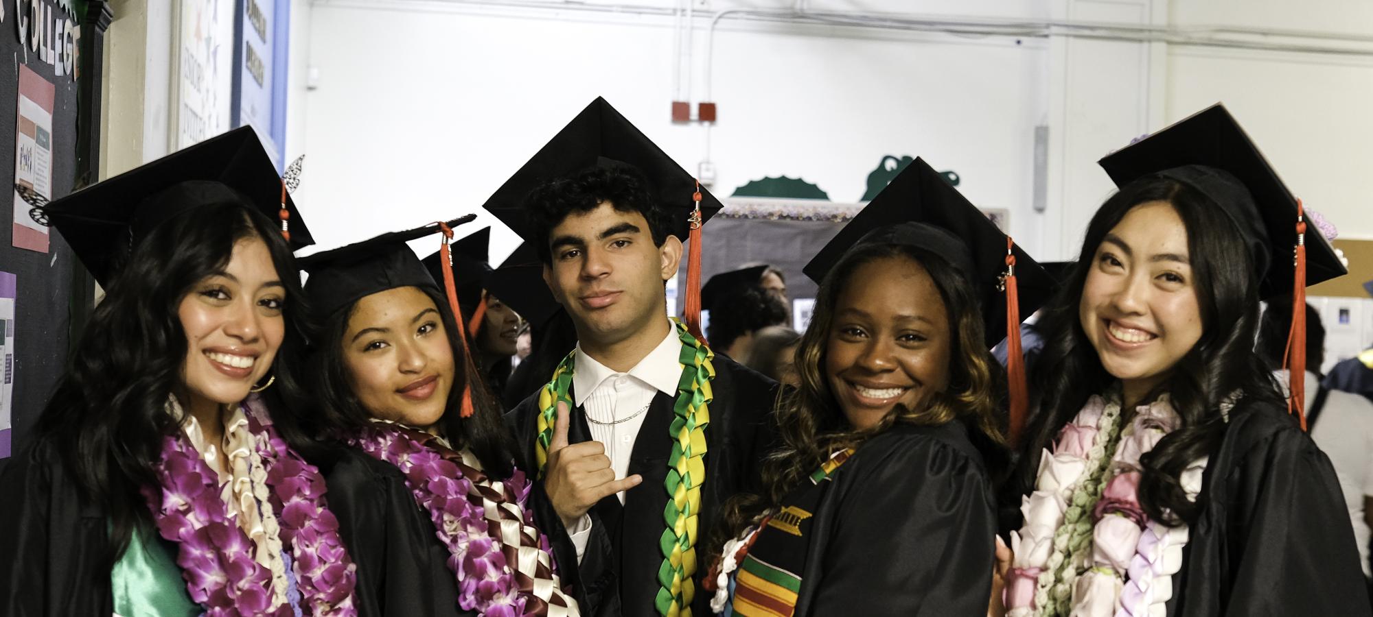 Students pose at graduation